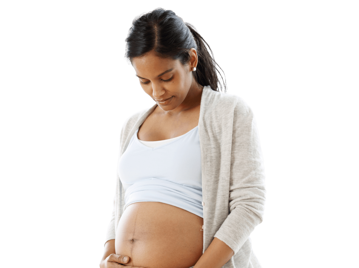 Pregnant woman rubbing her bare belly